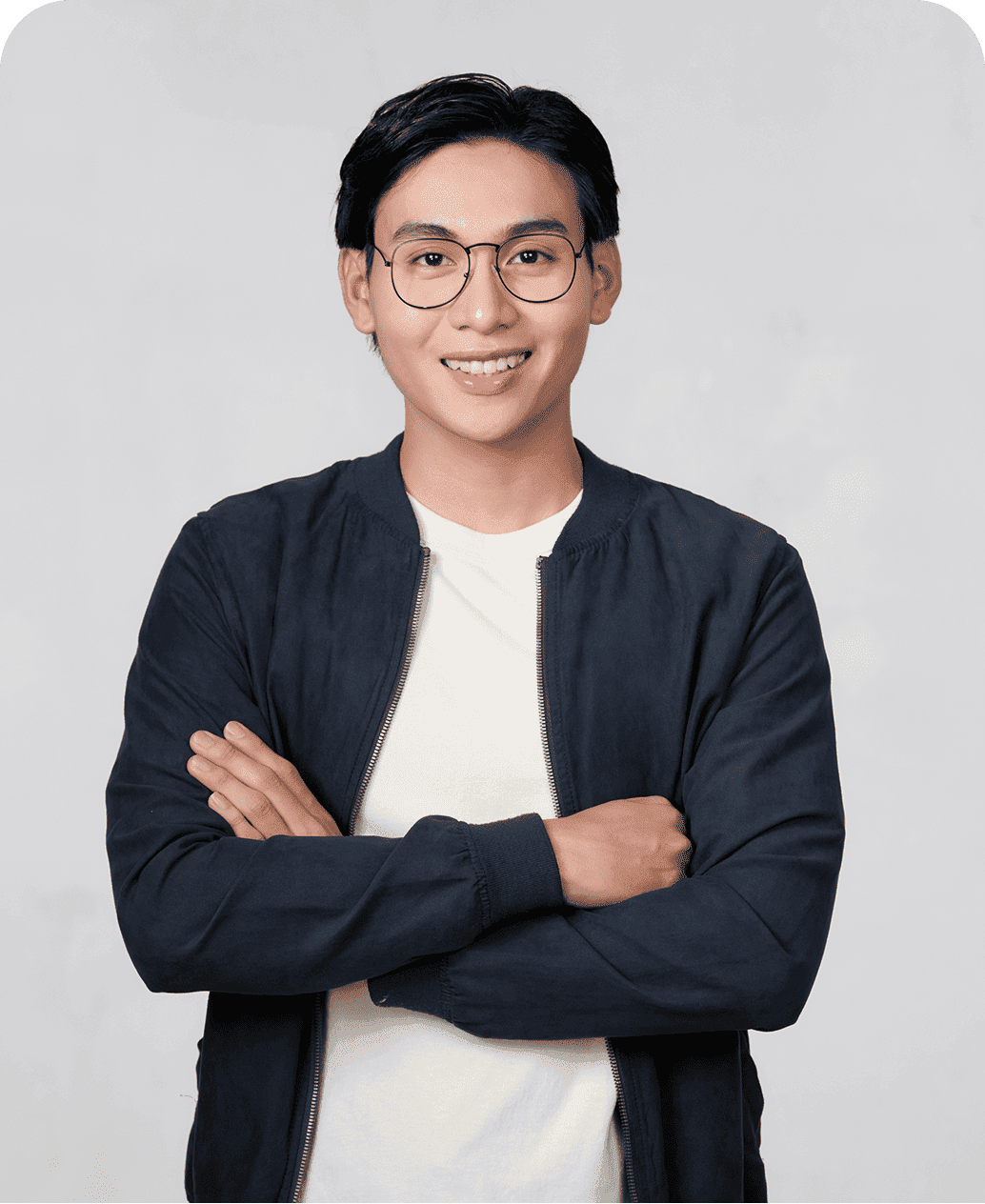 Confident professional standing with arms crossed