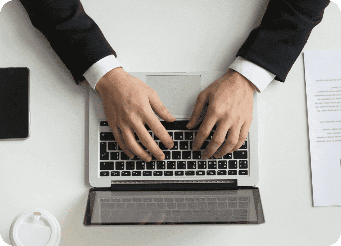 Person typing on a laptop keyboard
