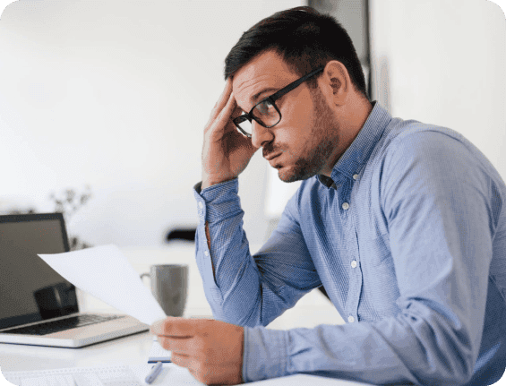 Business owner stressed at laptop