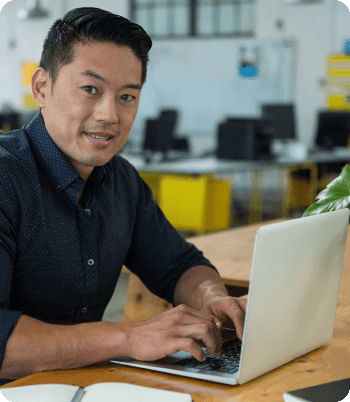Business professional working at desk representing VirtualStaff.ph clear definition