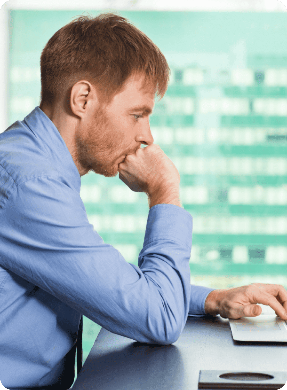 Team member thinking through priorities at a desk