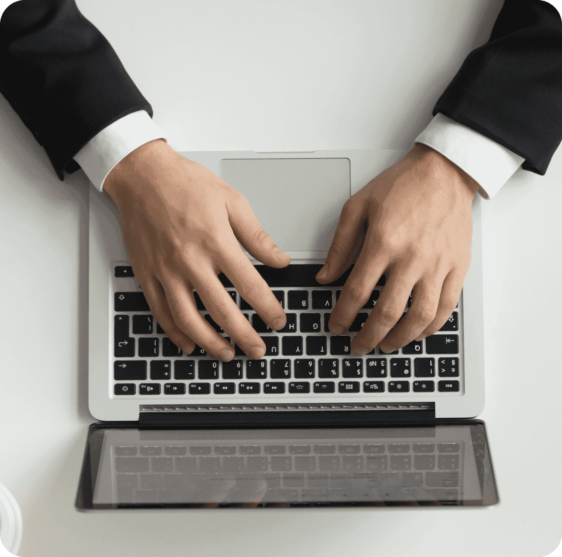 Hands typing on laptop — HelloRache managed outsourcing model